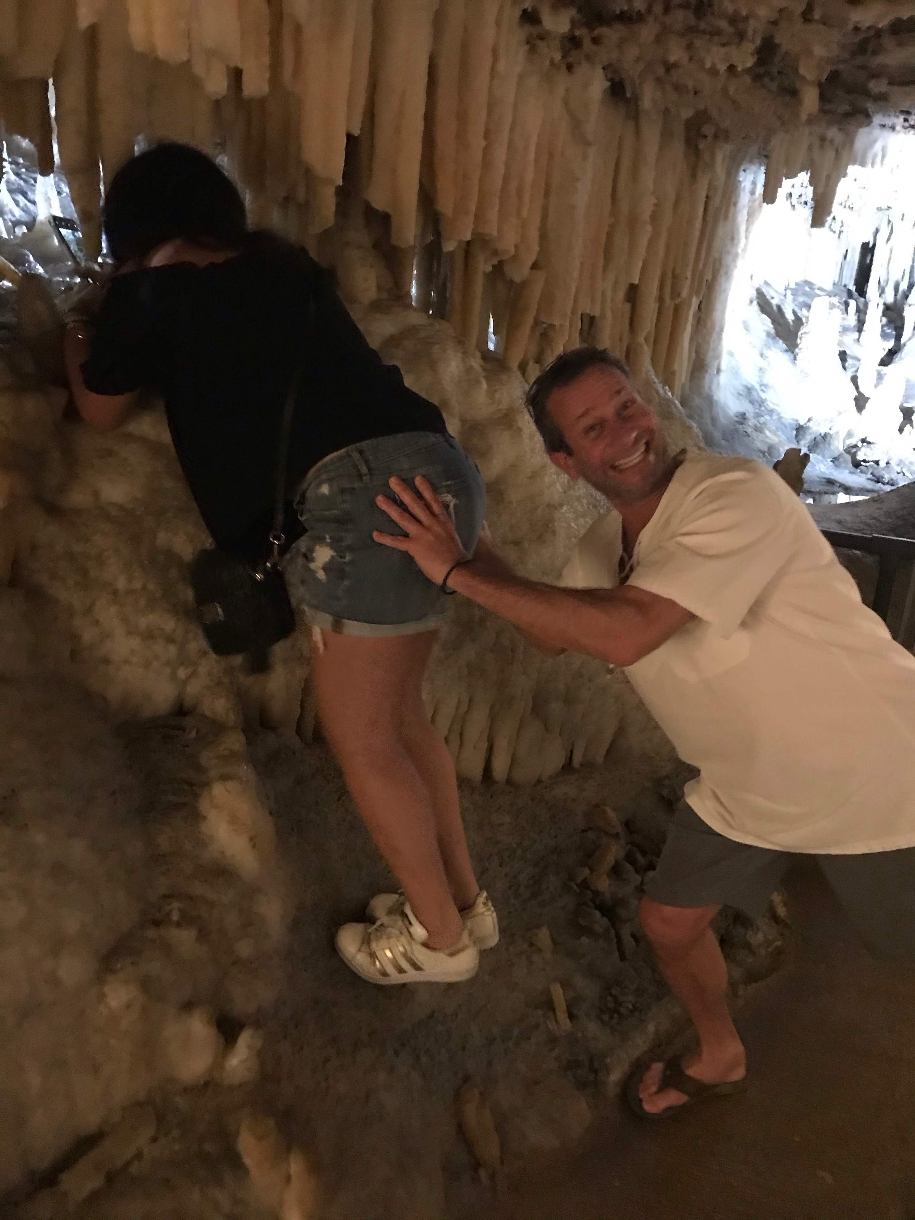 David and Kandi sharing a playful moment in a cave